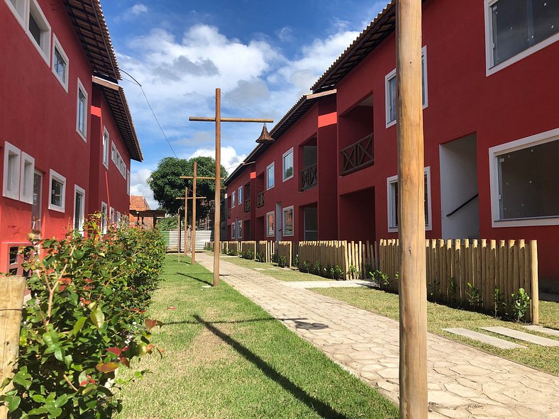 F 101 Apartamento térreo com jardim na região de Guarajuba